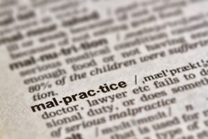 Medical malpractice shown in a dictionary